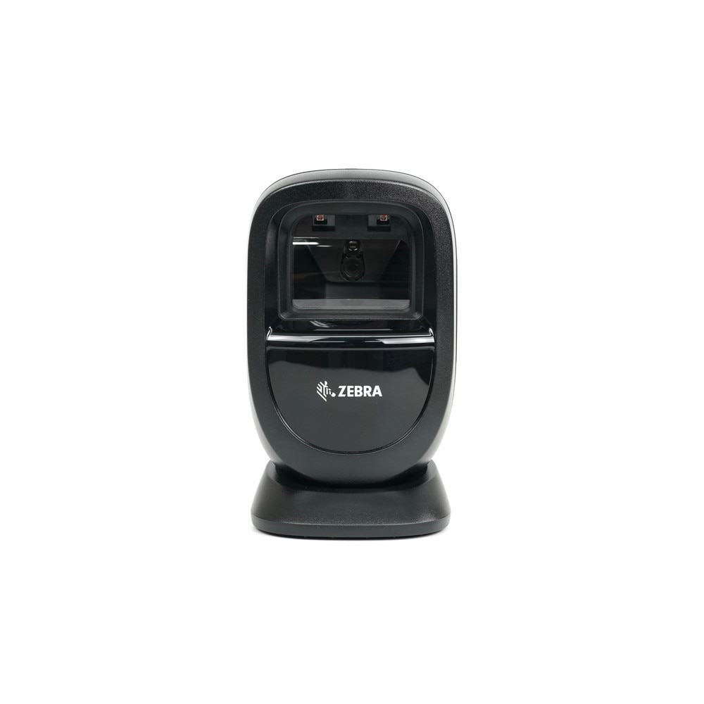 Zebra DS9308-SR4U2100AZE barcode scanner on a retail counter, showcasing its sleek design and scanning capabilities.